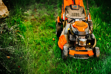 Garden and grass maintainance details - close up view of grass mower, lawnmower details