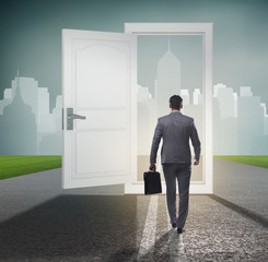 Businessman in front of door in business opportunities concept