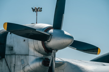 Propeller and engine of big old retro cargo airplane, close up