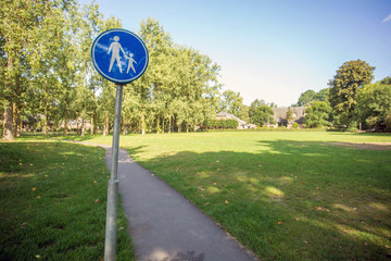 Walkway sign for pedestrians in green park