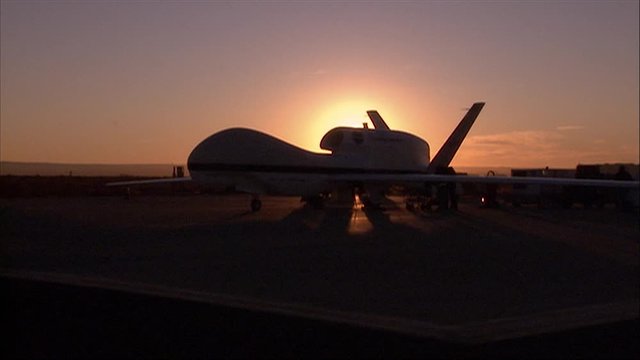 An unmanned drone at sunrise.