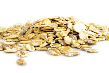 Oat flakes, pile of oatmeal - Organic ingredients for healthy breakfast.