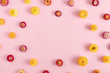 Autumn creative flowers composition. Colorful flowers on pastel pink background. Fall concept. Autumn background. Flat lay, top view, copy space