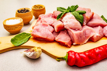 Raw pork neck, cut into pieces with fresh vegetables and dry spice