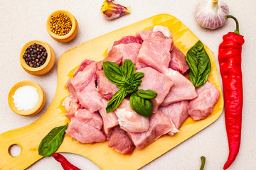 Raw pork neck, cut into pieces with fresh vegetables and dry spice