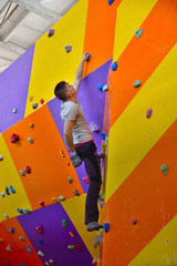 Fototapeta na wymiar Climber On Artificial Climbing Wall