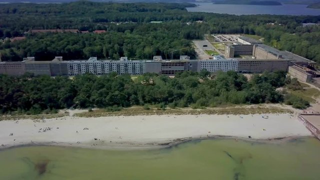 Timelapse: Aerial view on Prora, a massive project known as Colossus of Prora built by the Nazi-Regime that is currently reconstructed to host new flats and a hotel. Located at the baltic sea on the