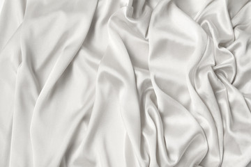 Obraz premium silk knitted fabric softly draped with small folds, texture, background, form for postcard, copy space