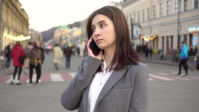Girl Talking On The Phone On The Street