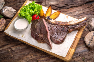 Neck steak, tenderloin or filet mignon pork or beef. Juicy tasty piece of meat. Delicious juicy steak.  A big piece of grilled meat.