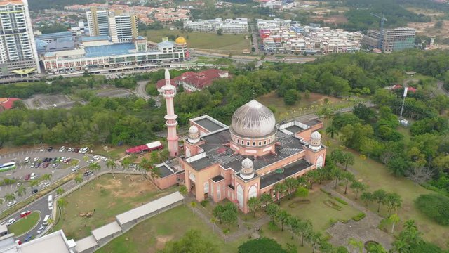 Amazing Beautiful aerial footage of red Mosque of Universiti Malaysia Sabah (UMS) in Kota Kinabalu, Sabah with its red cupola.