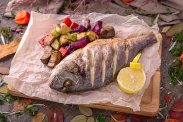 Grilled dorado fish with grilled vegetables. Beautiful stylish menu.  Free space for text