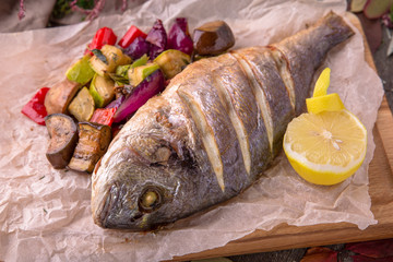 Grilled dorado fish with grilled vegetables. Beautiful stylish menu.  Free space for text