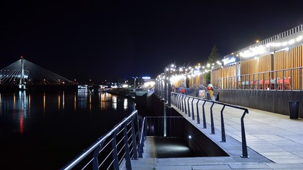 Fototapeta premium The promenade at the bank of river in night