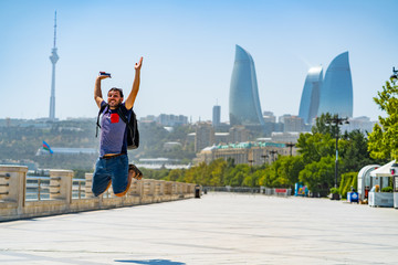 Fototapeta na wymiar happy tourist take selfie photo in Baku, Capital of Azerbaijan. Travelling in Caucasus country