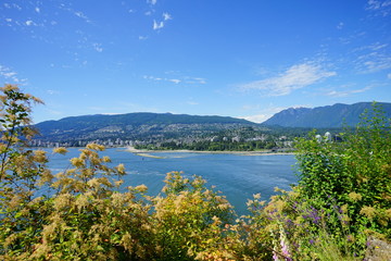 Naklejka na ściany i meble Beautiful Vancouver bay beach and mountain seen from Stanley park 