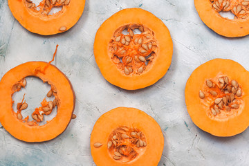 Creative arrangement of round sliced pieces of fresh pumpkin
