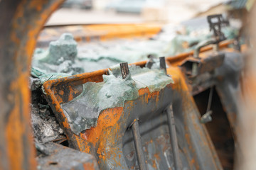 car after deliberate arson. destroyed vehicle after a fire melted is on the street.