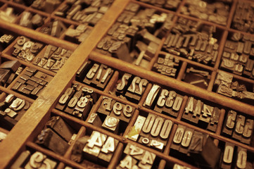 Metal letterpress numbers in drawer