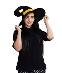 Portrait of young woman in witch costume isolated on white background. Halloween theme on white