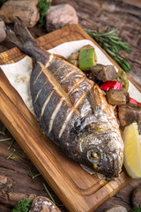 Grilled dorado fish with grilled vegetables. Beautiful stylish menu.  Free space for text