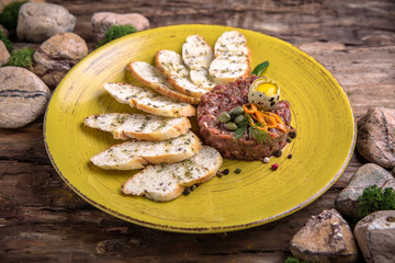 Beef tar tar with quail egg and croutons