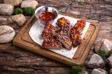 Grilled Pork Ribs. Tasty juicy meat with spicy tomato sauce