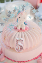 Beautiful cake for the holiday with a unicorn. Sweet birthday dessert.