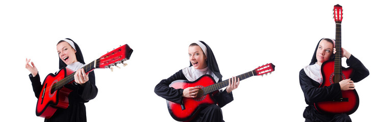 Fototapeta premium Nun playing guitar isolated on white