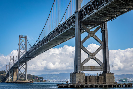 San Francisco bay bridge on a clear day with white clouds in the background © Chris Anderson 