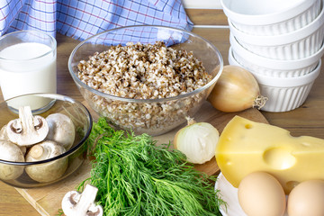 Ingredients for cooking buckwheat casserole with mushrooms. Products for cooking a delicious dish. Wholesome food.