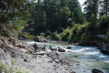 The confluence of two rivers. Two different rivers are connected into one. The river is of...