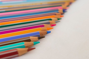 Fototapeta premium colored pencils and white background