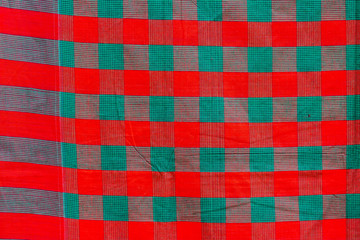 Fototapeta premium Green and red strip cotton Gamcha(Bath towel) Fabrics Close-up.