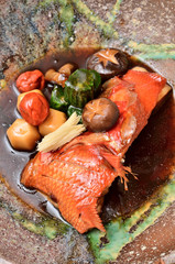 Braised fish in soy sauce on the plate