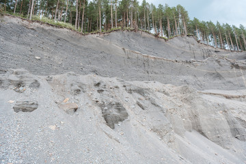 stone quarry. mine stone. stone quarry under the forest. pine forest over a stone quarry. small...