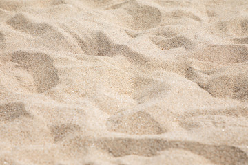 Fototapeta na wymiar Closeup brown sand on the beach