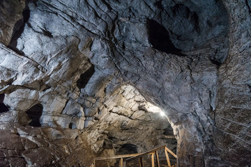 stone caves. caves in the mountains. visit the tour. leisure. large stones underground. tunnels in the mountains. stone tunnels.