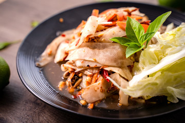 SOM-TAM, Laos (Luang Prabang Papaya Salad) delicious raw papaya salad with unique taste hot and spicy, this dish with tomato, carrot, peanut and Crab sauce