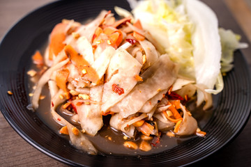 SOM-TAM, Laos (Luang Prabang Papaya Salad) delicious raw papaya salad with unique taste hot and spicy, this dish with tomato, carrot, peanut and Crab sauce