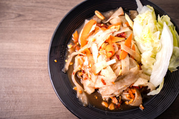 SOM-TAM, Laos (Luang Prabang Papaya Salad) delicious raw papaya salad with unique taste hot and spicy, this dish with tomato, carrot, peanut and Crab sauce