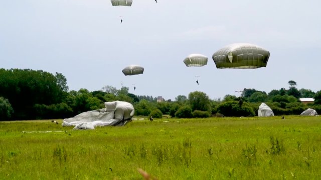 Many paratroopers land in a field near Sainte-Mere-Eglise, France for the 75th commemoration of D-Day, June 9th, 2019