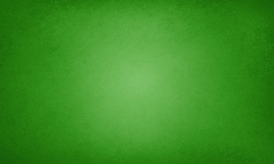 Green background with faint texture and bright center and vignette border, elegant luxury green color in old vintage layout © Arlenta Apostrophe