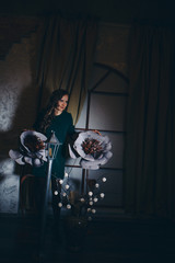 beautiful girl among the flowers and lantern in the shade. Spring mood-a woman in a fairy-tale world