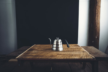 black coffee drip On the wood Dark tone