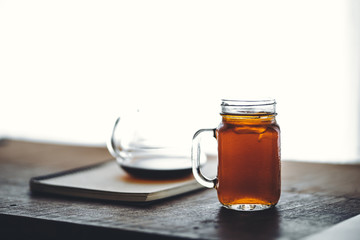 black coffee drip On the wood Dark tone