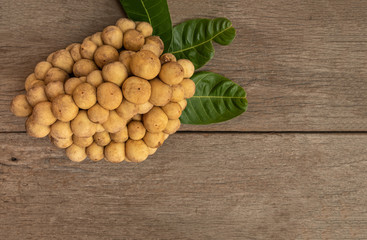 Longkong or langsat popular Tropical fruit from Southeast Asia. sweet and juicy. on wooden background.