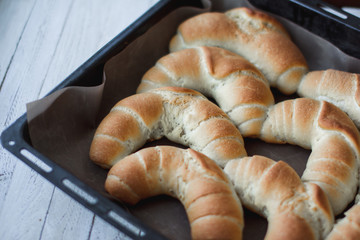 fresh crusty bread rolls in a wheat leaven