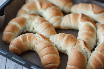 fresh crusty bread rolls in a wheat leaven