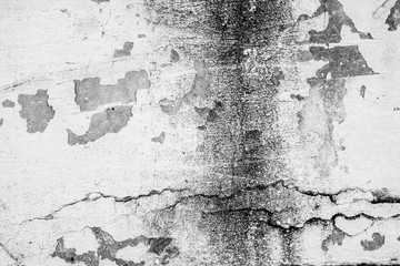 Texture of a concrete wall with cracks and scratches which can be used as a background